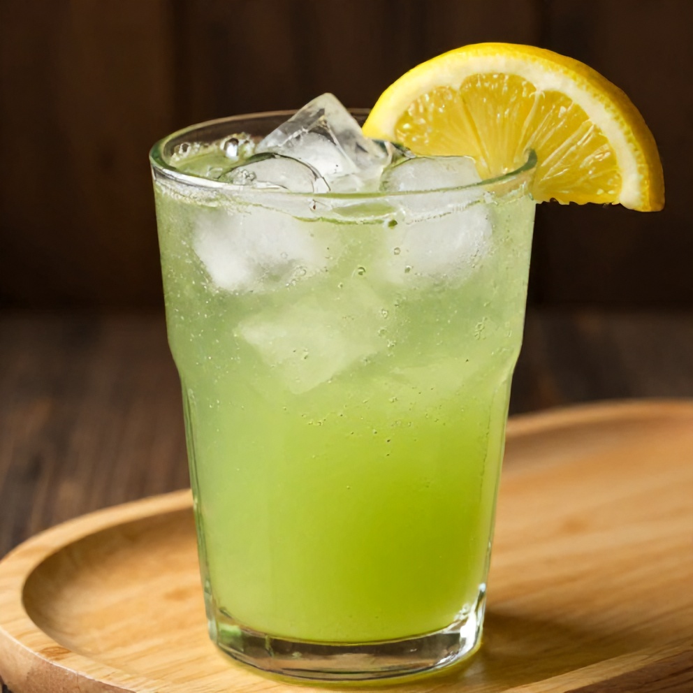 Glass of refreshing spring celery apple juice with a lemon slice garnish